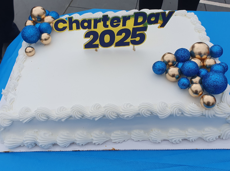 Birthday cake celebrating 56 years since OU gained its Royal Charter