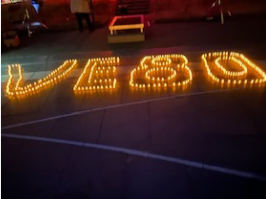 VE80 spelt out in tealights at night